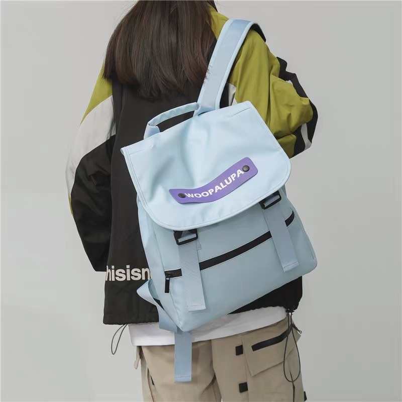 Balo Woo Unisex Quai Cài Khuy Hai Bên Chống Nước Dày Dặn, Balo Đi Học Nam Nữ Tag Da Cá Tính