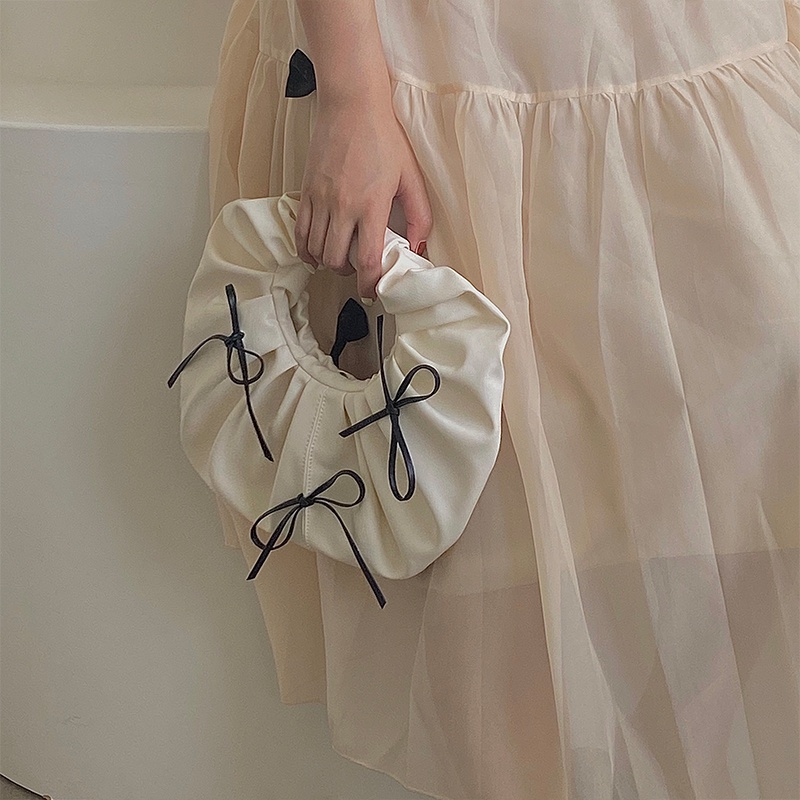 Túi xách tròn nhỏ đính nơ thời trang cho nữ