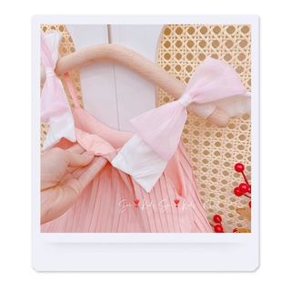 Váy dập ly nơ vai bé gái
