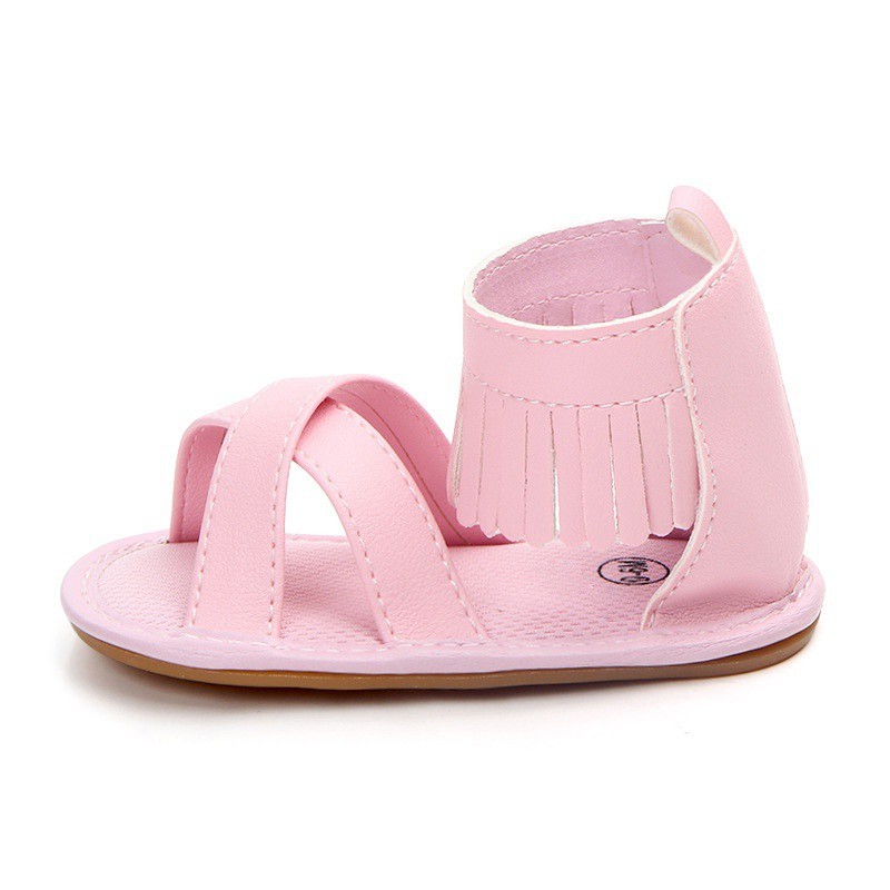 Giày sandal da PU màu trơn quai đan chéo phối tua rua đáng yêu cho bé gái