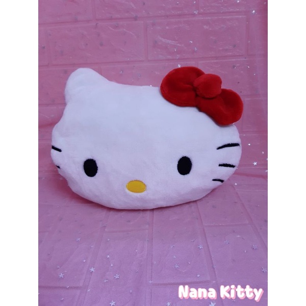Gối bông đầu mèo Hello Kitty nơ đỏ ủ ấm tay