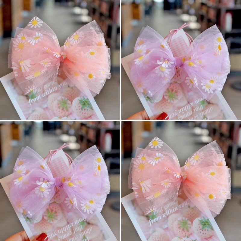 Kẹp tóc bé gái nơ voan hoạ tiết hoa cúc vàng