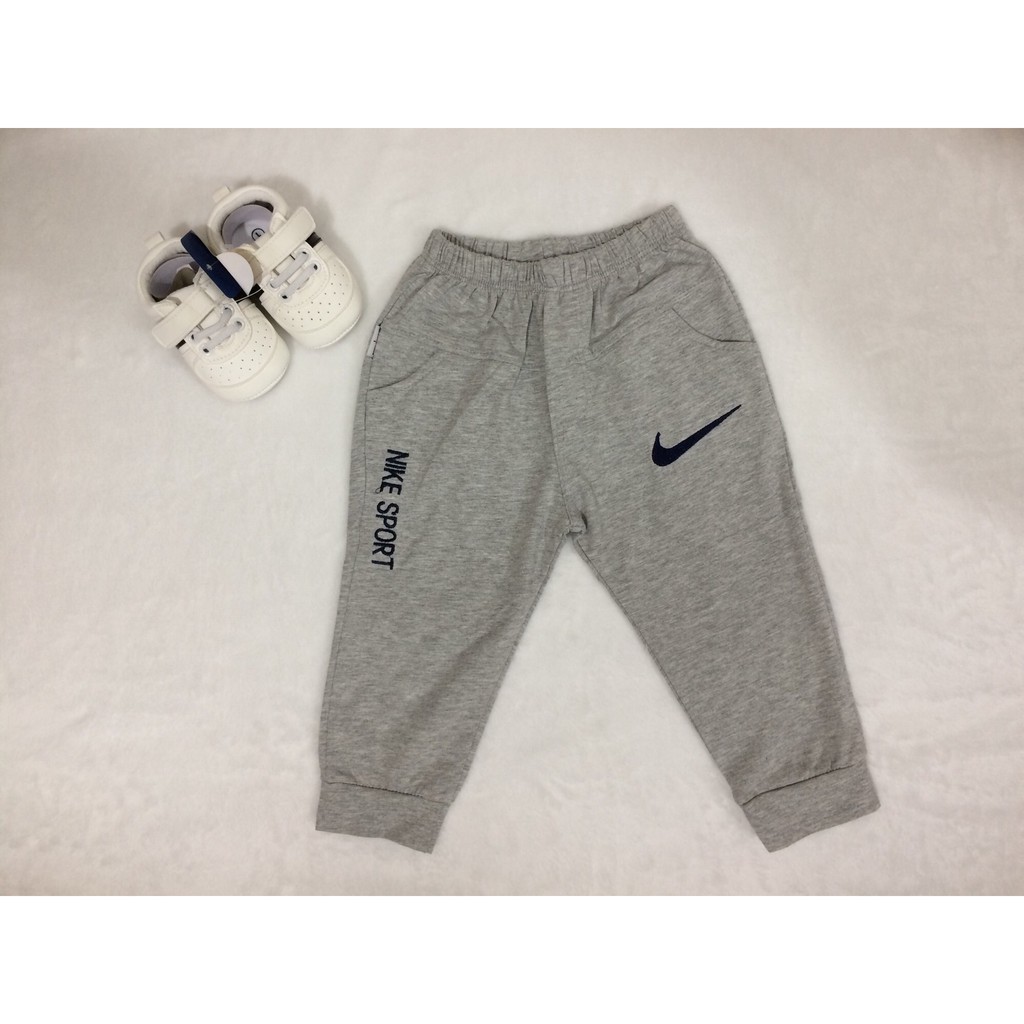 Quần bo ống bé trai Nike