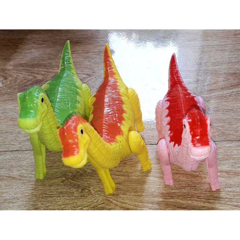 Một Khủng Long mô hình bằng nhựa kích thước 24x16x8 cm chạy pin có nhạc và đèn Led rất đep_tặng kèm pin