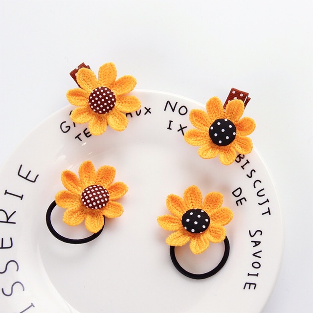 Sỉ 10 buộc tóc hình hoa len đan 53k