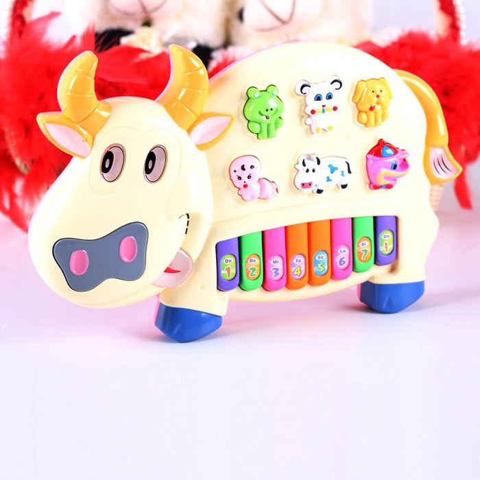 Đồ chơi đàn piano hình chú bò sữa cho bé xanh