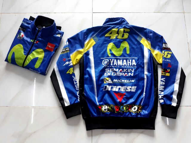 Áo Khoác Yamaha Movistar Vải Dù 2 Lớp Chống Nước, Logo Trên Áo Được Bảo Hành Vĩnh Viễn Không Bung Tróc.