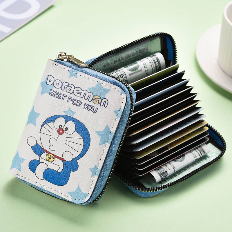 Ví Nữ cầm tay mini có khóa kéo, nhiều ngăn in hình Doraemon dễ thương dùng đựng tiền, thẻ ATM,...