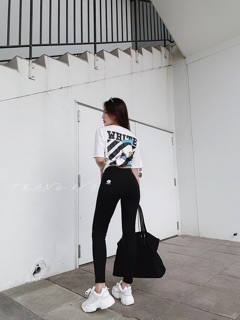 Quần legging in hoa cúc vàng