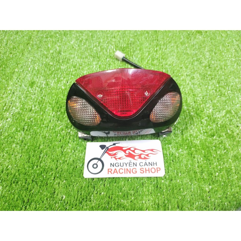 Xi nhan pha đèn hậu satria 2000