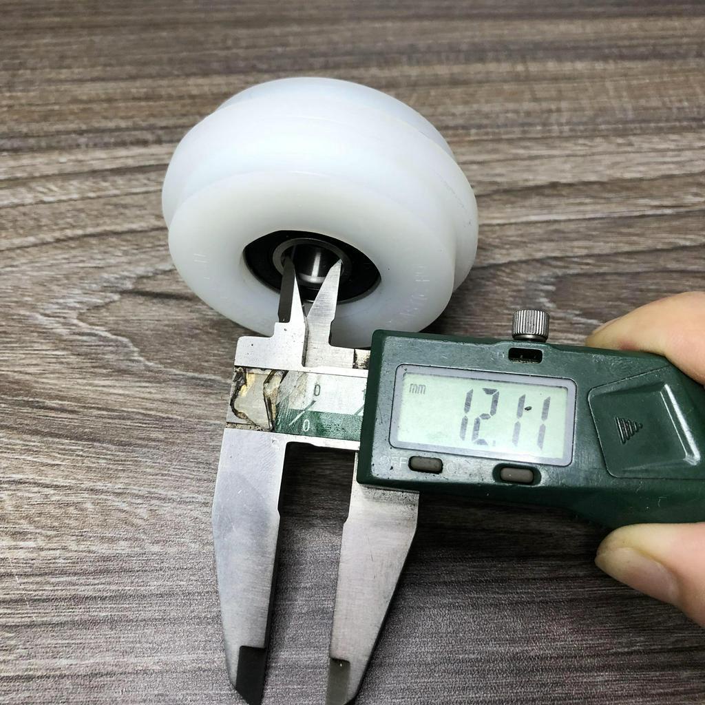 Bánh xe con lăn cửa lùa cửa trượt phi 68mm dùng cho ray lùa âm D6826d12T7D