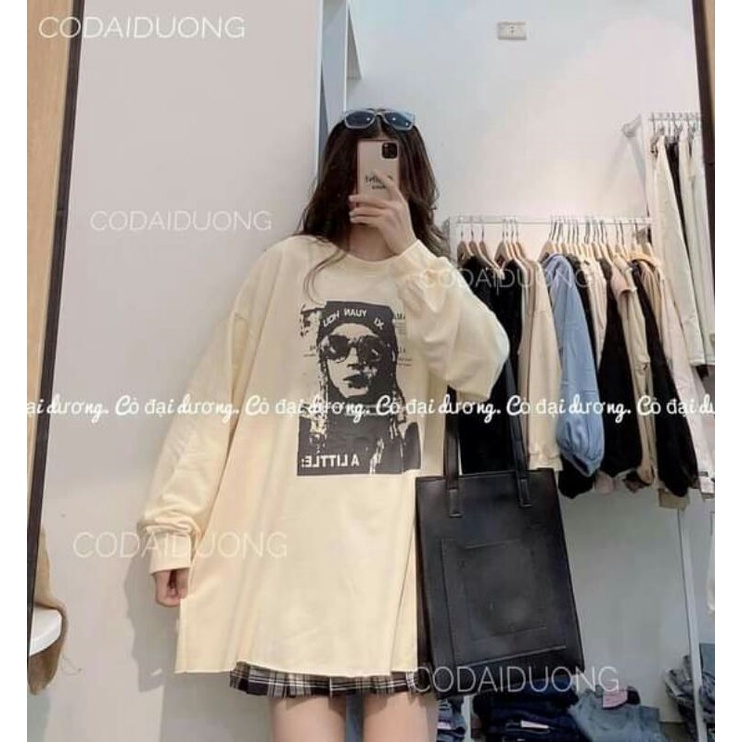 Áo swater thụng cô gái đeo kính