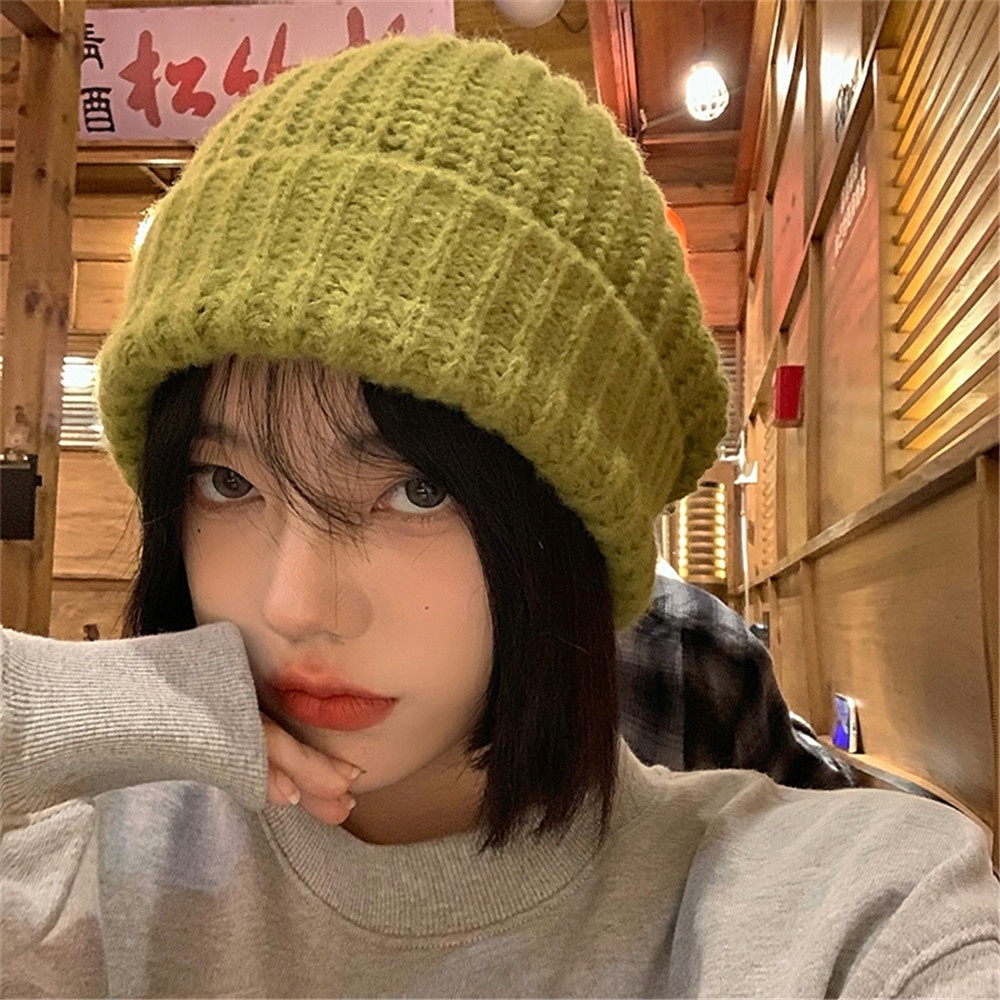 1 chiếc mũ len giữ ấm màu trơn đơn giản và giảm đau mùa đông