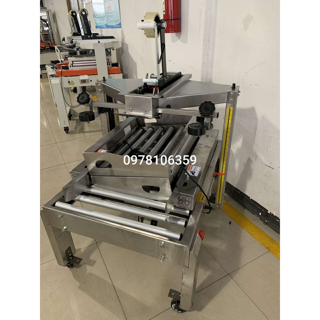 Máy dán thùng inox, máy dán băng keo thùng carton, máy dán thùng inox hoàn toàn