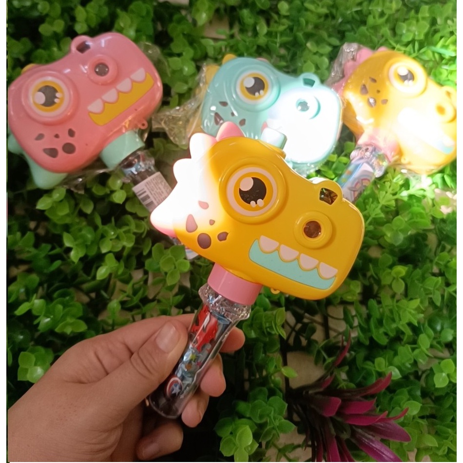 Kẹo đồ chơi máy ảnh khủng long chiếu hình có pin