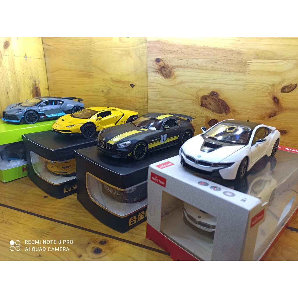 Mô hình xe ô tô siêu xe BMW I8 Hãng Rastar tỉ lệ 1:24 màu trắng, vỏ hợp kim, mở được cửa