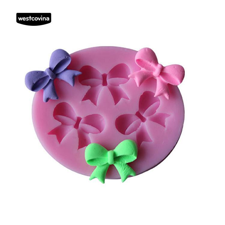 Khuôn silicone màu hồng họa tiết nơ trang trí bánh