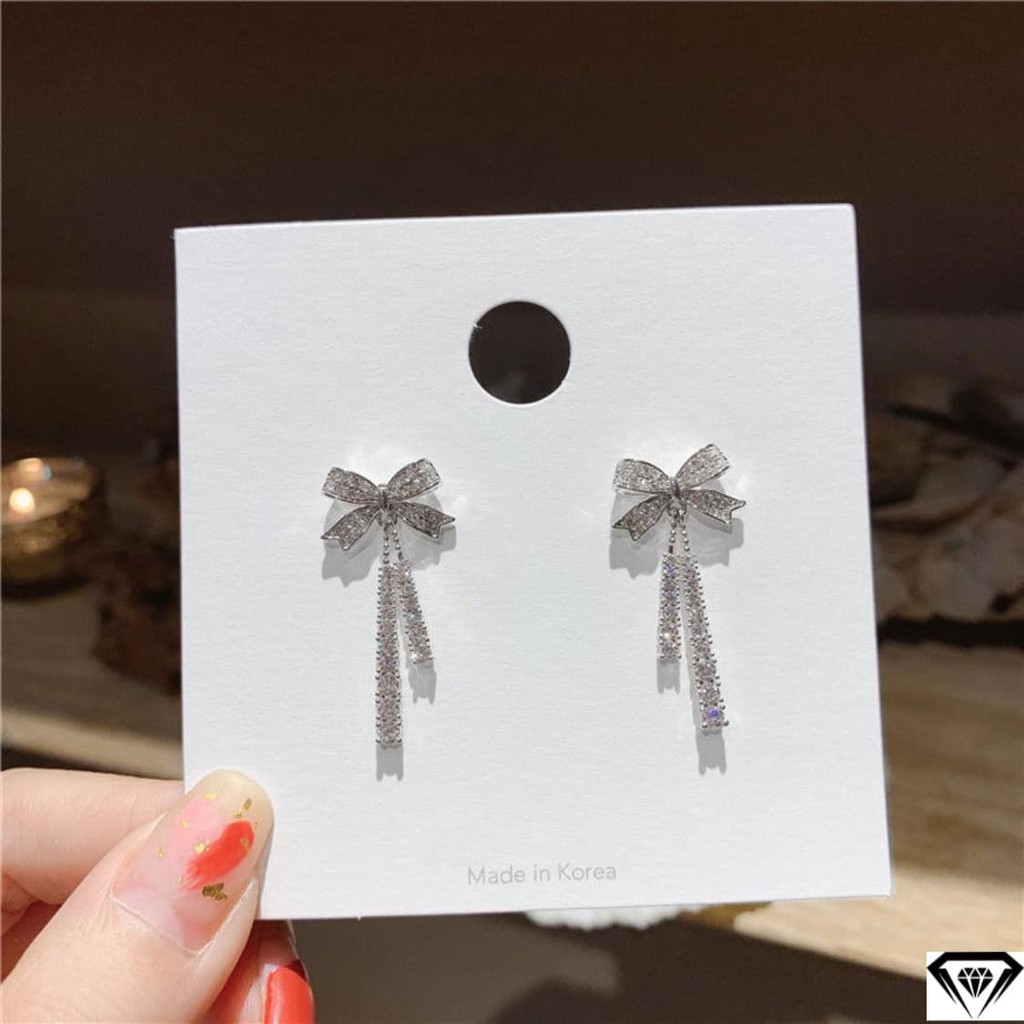 Hoa tai nữ thắt nơ bạc ta xinh tua dáng dài