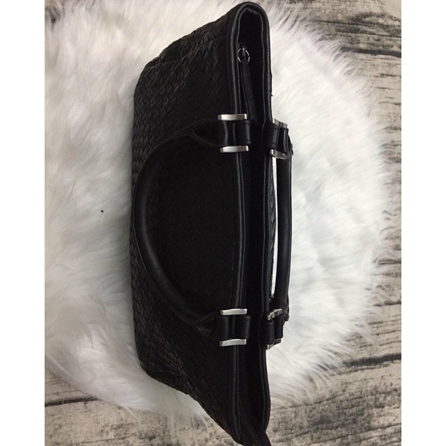 Túi cầm tay da đan