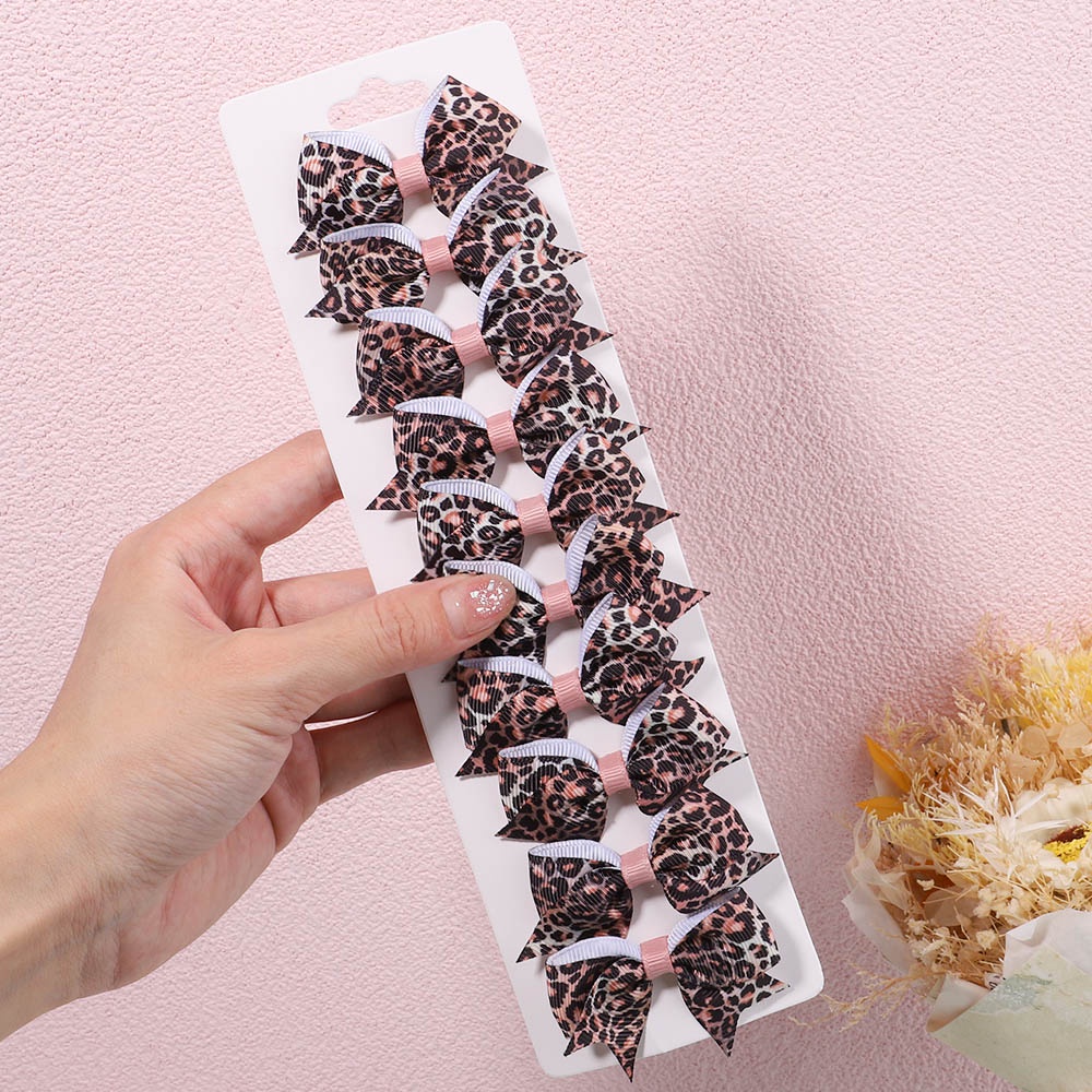 Set 10 kẹp tóc KIDSBOWS đính nơ họa tiết da báo cho bé gái