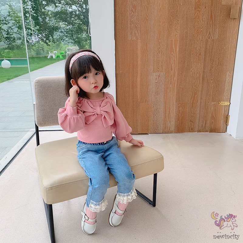 Áo dài tay phối nơ phong cách đáng yêu dành cho bé gái