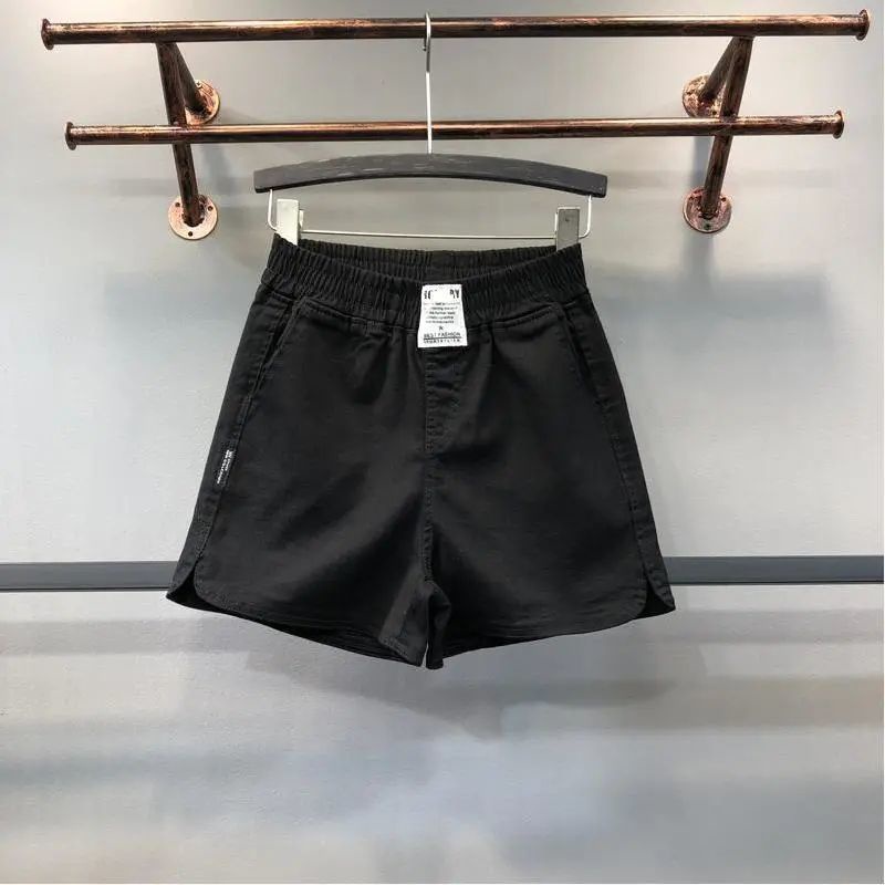 Quần short denim trắng chữ A lưng thun thể thao nóng bỏng Châu Âu