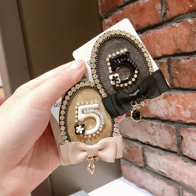 Ghim cài áo hình nơ đính ngọc trai giả sang trọng