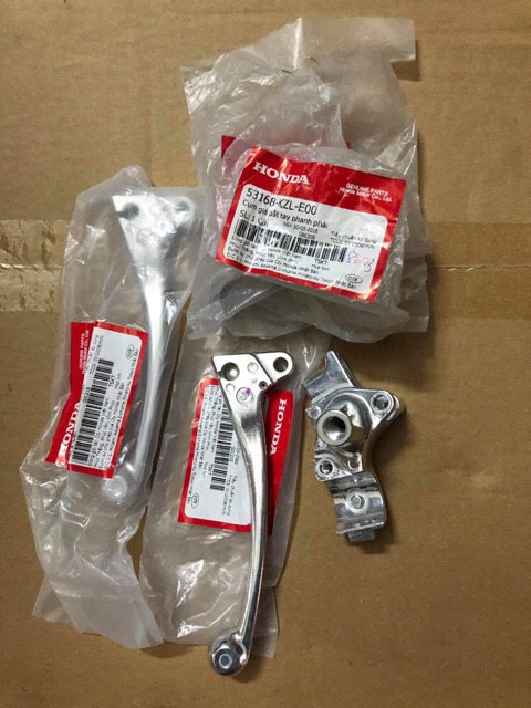 Giá đỡ tay thắng + tay thắng phải Vision zin hãng Honda