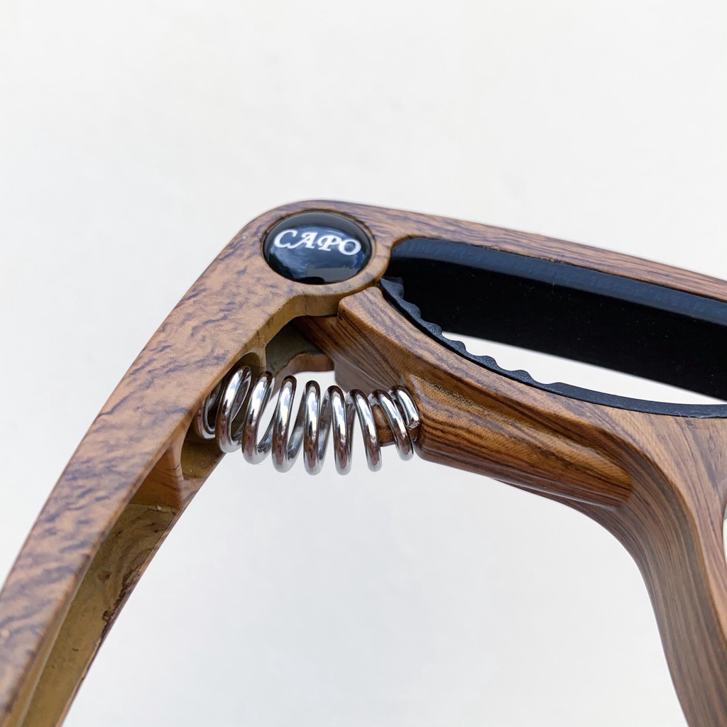 Capo Guitar Acoustic cao cấp - tích hợp mở chốt giữ dây | Chất liệu kim loại & nhựa |