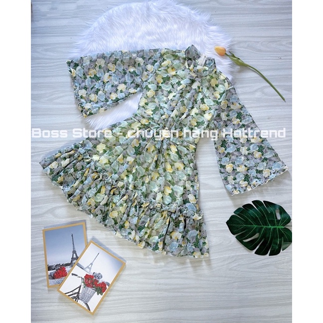 Váy HOA THIẾT KẾ  dáng xòe, tay cánh tiên. Chất voan hoạ tiết tay loe kèm dây buộc lưng.