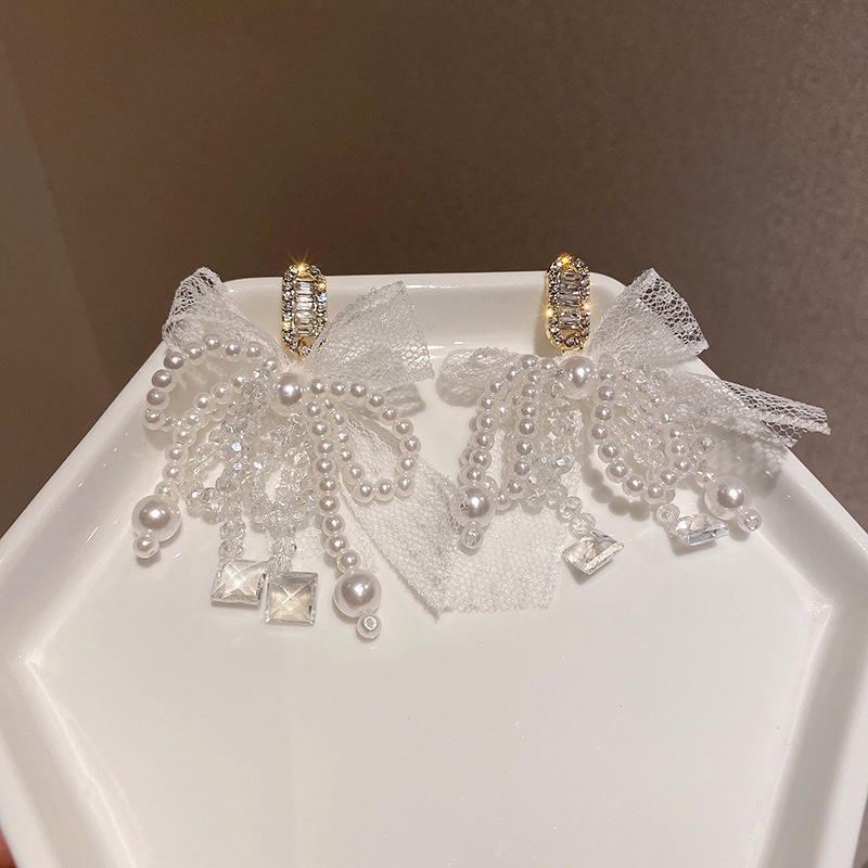 Khuyên tai bạc 925 phối nơ đính đá zircon và ngọc trai nhân tạo thời trang