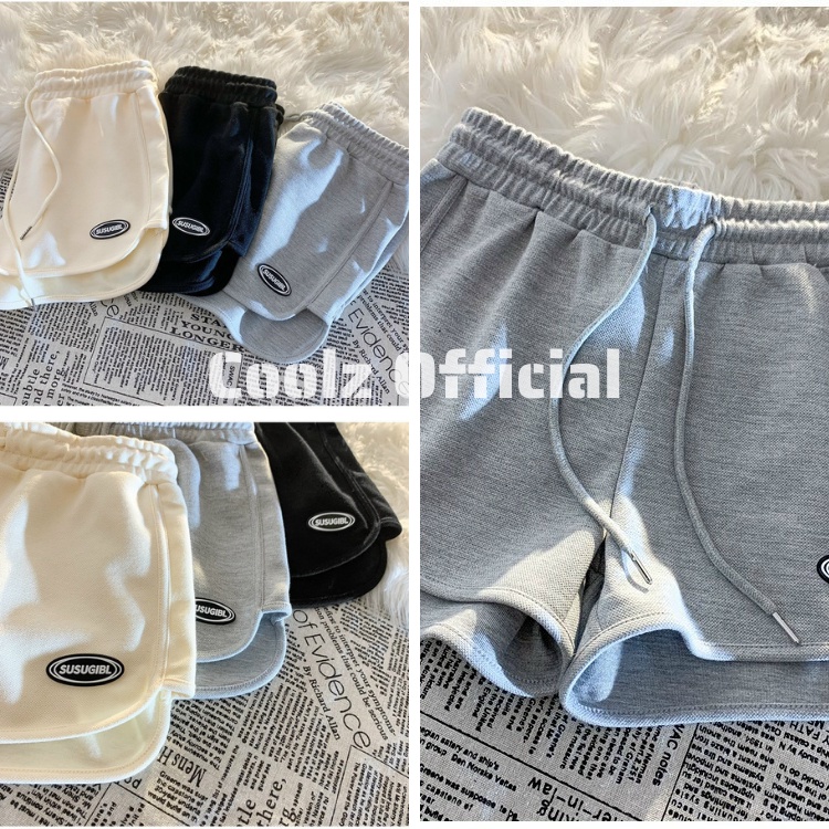 Quần Short Đùi chạy viền in logo Unisex nam nữ ống rộng cạp chun 3 màu đen, trắng, be chất liệu thun cotton