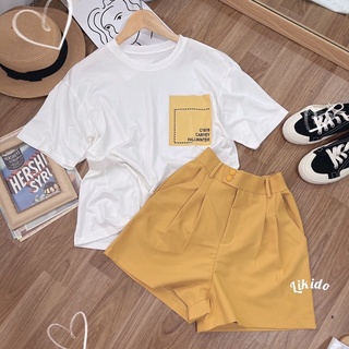 Set áo thun trắng và quần shorts vàng
