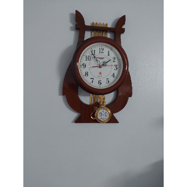 Đồng hồ quả lắc hình cây đànkt 60×40×5cm