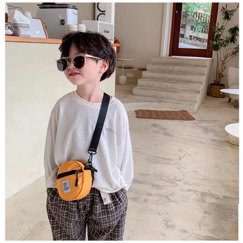 Túi đeo chéo hình tròn cho bé, vải dù
