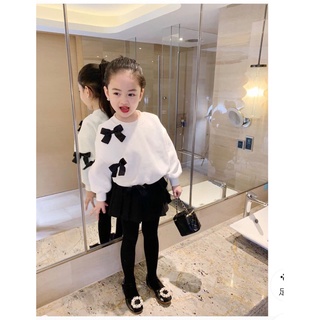 Áo da cá gắn nơ nhỏ xinh bé gái
