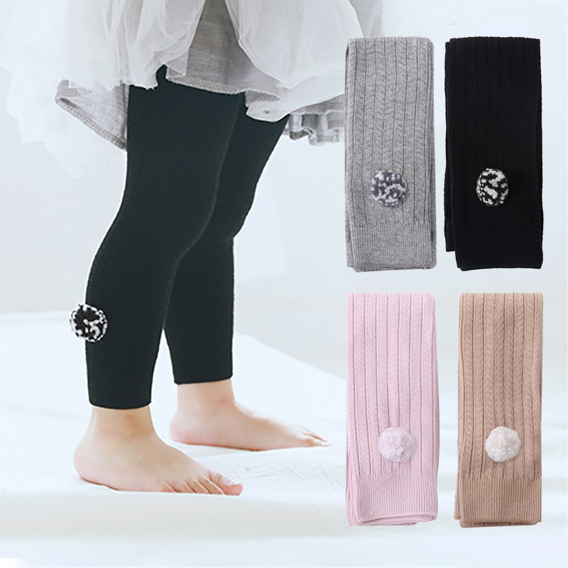 Quần legging vải cotton mềm mại đính quả bông lông nhung màu trơn đáng yêu dành cho bé gái