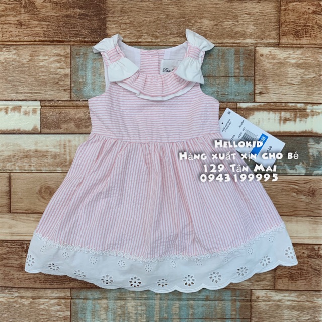 Váy kẻ cổ xoè nơ đục lỗ