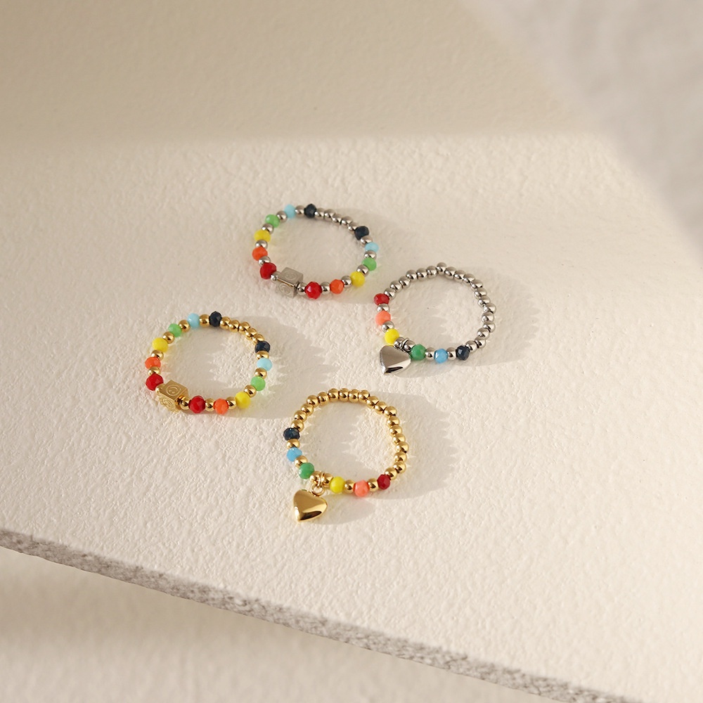 Nhẫn nữ titan kiểu xâu chuỗi bi tròn và thủy tinh màu sắc mặt cười trái tim không gỉ WE2209