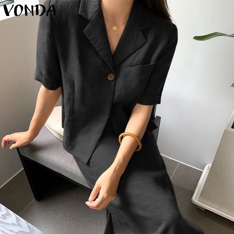 Bộ VONDA gồm áo ngắn tay màu trơn cổ bẻ + chân váy dài lưng cao phối khóa kéo cá tính dành cho nữ