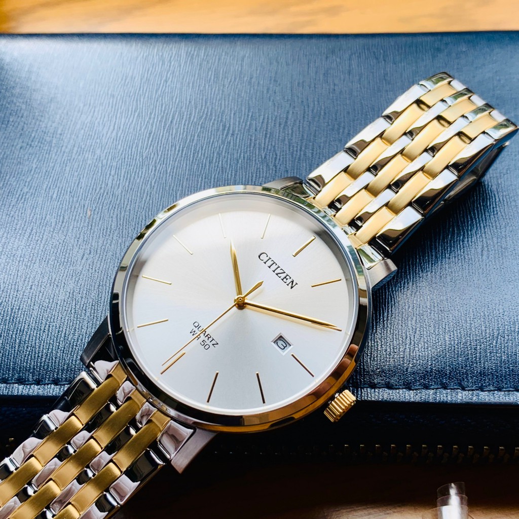 Đồng hồ đôi Nam/Nữ chính hãng Citizen BI5074-56A Mặt trắng,Lịch ngày-Máy Pin Quartz-Dây kim loại-Size Nam 39,Nữ 28mm