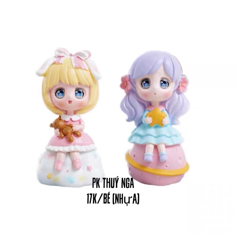 Búp bê ngồi trang trí bánh kem