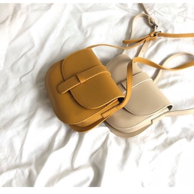 Túi bầu khuy, chất cực thích, dáng xinh dễ phối đồ