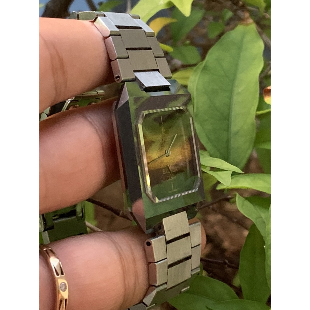 Đồng hồ nam RADO cơ cót, máy vàng, mặt chữ nhật thiết kế chuyển màu, dây kim loại của Thụy