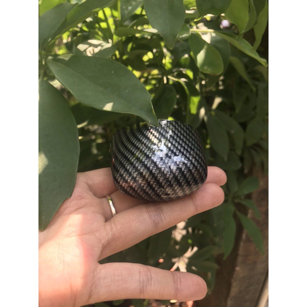 Ốp /chụp đèn soi biển số xe Exciter 150 màu Cacbon.