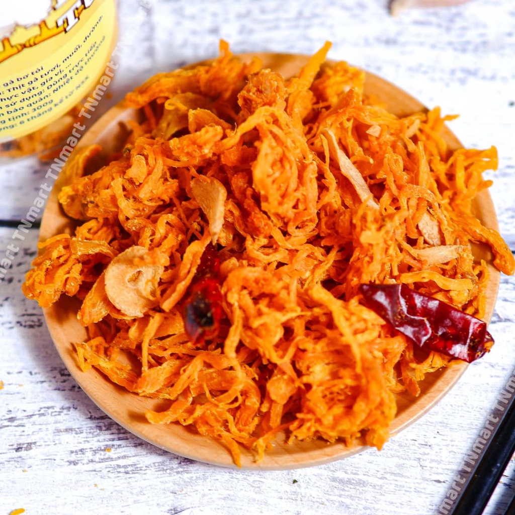 Khô gà sấy bơ tỏi xé cay lon pet 300g ăn vặt TiNimart ăn vặt ngon rẽ