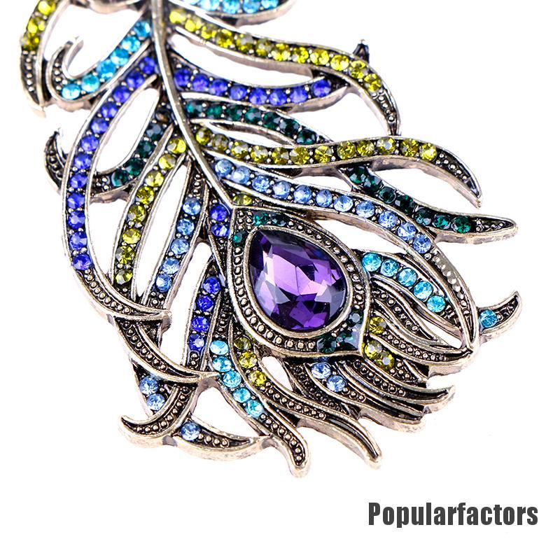 Ghim cài hình lông công đính đá thời trang