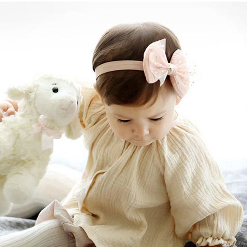 Băng đeo đầu có chi tiết nơ trang trí