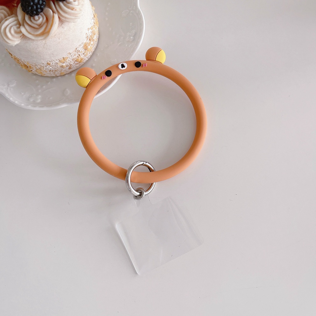 Dây Đeo Cổ Tay Kiêm Vòng Đỡ Điện Thoại Di Động Bằng Silicon Mềm Kiểu Hoạt Hình Đơn Giản Sáng Tạo Chống Rơi