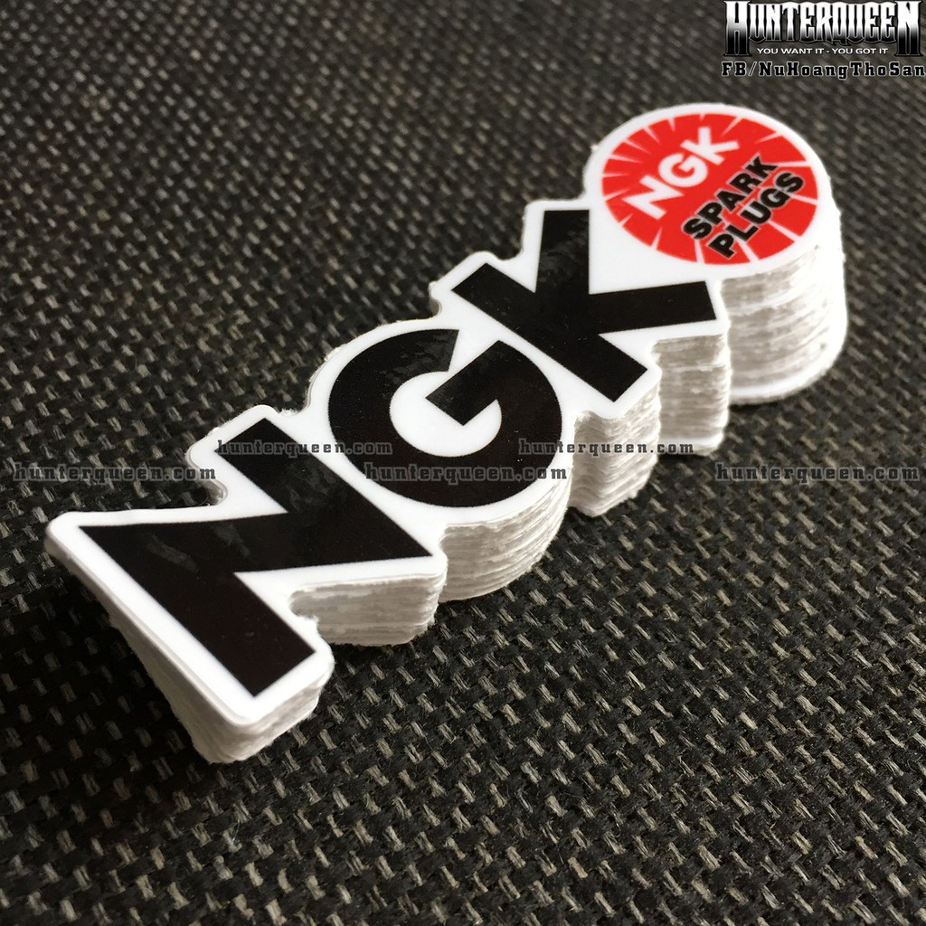 NGK[8.5X2.4cm] decal cao cấp chống nước, sắc nét, bền màu, dính chặt. Hình dán logo trang trí mọi nơi, in theo yêu cầu